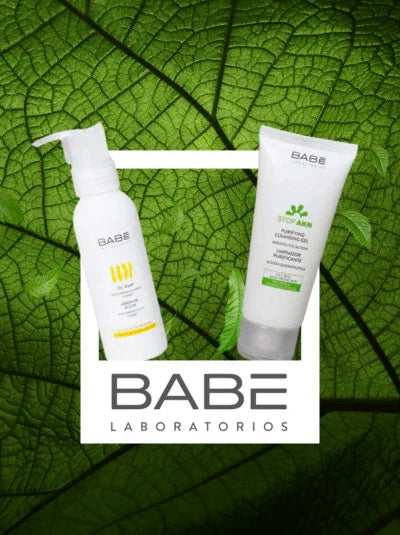 Babe Laboratorios skincare products displayed on green leaf background, dermatologist-approved