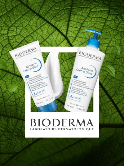Two Bioderma Atoderm Crème Ultra skincare products against a green leaf background.