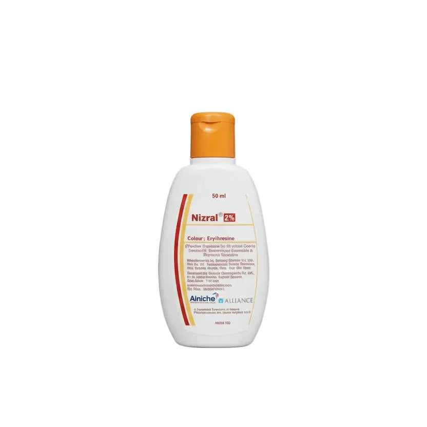 Nizoral bottle with orange cap on a white background